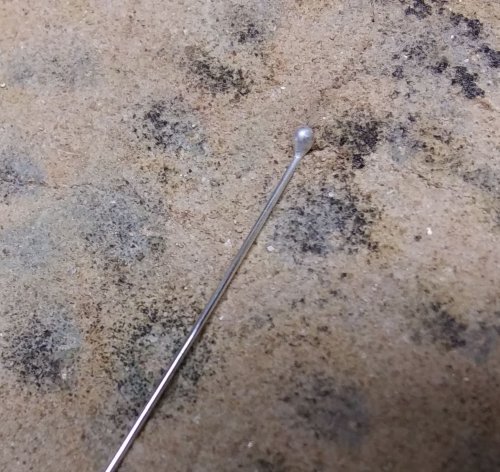 Judy Larson's Bali Style Earrings - , Contemporary Wire Jewelry, Stamping, Stamps, Butane Torch, Soldering, Solder, Drilling, Drill, hold the “golf club” head of the balled wire upright.